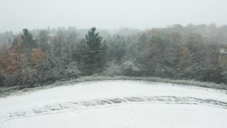 Aerial-of-a-Canadian-rural-landscape-and-a-strong-blizzard-coming-from-the-side