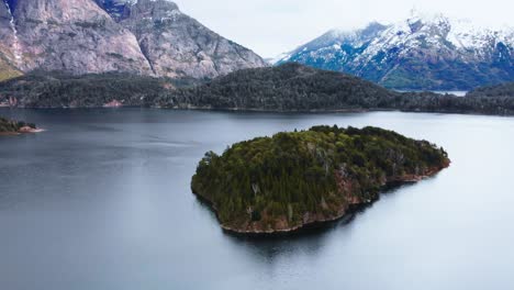 above patagonia: an aerial view of snowy peaks, lush forests, and a reflective lake