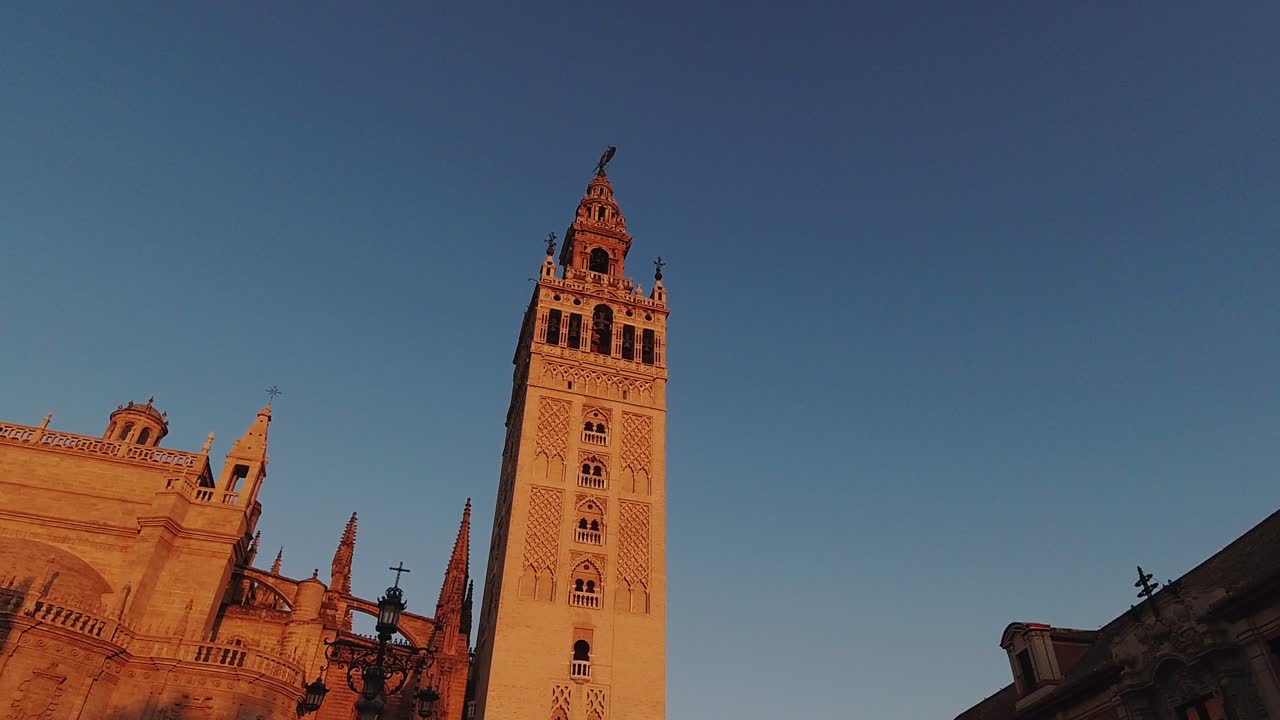 Hyperlapse walking towards Giralda Cathedral Tower in Sevilla during sunrise