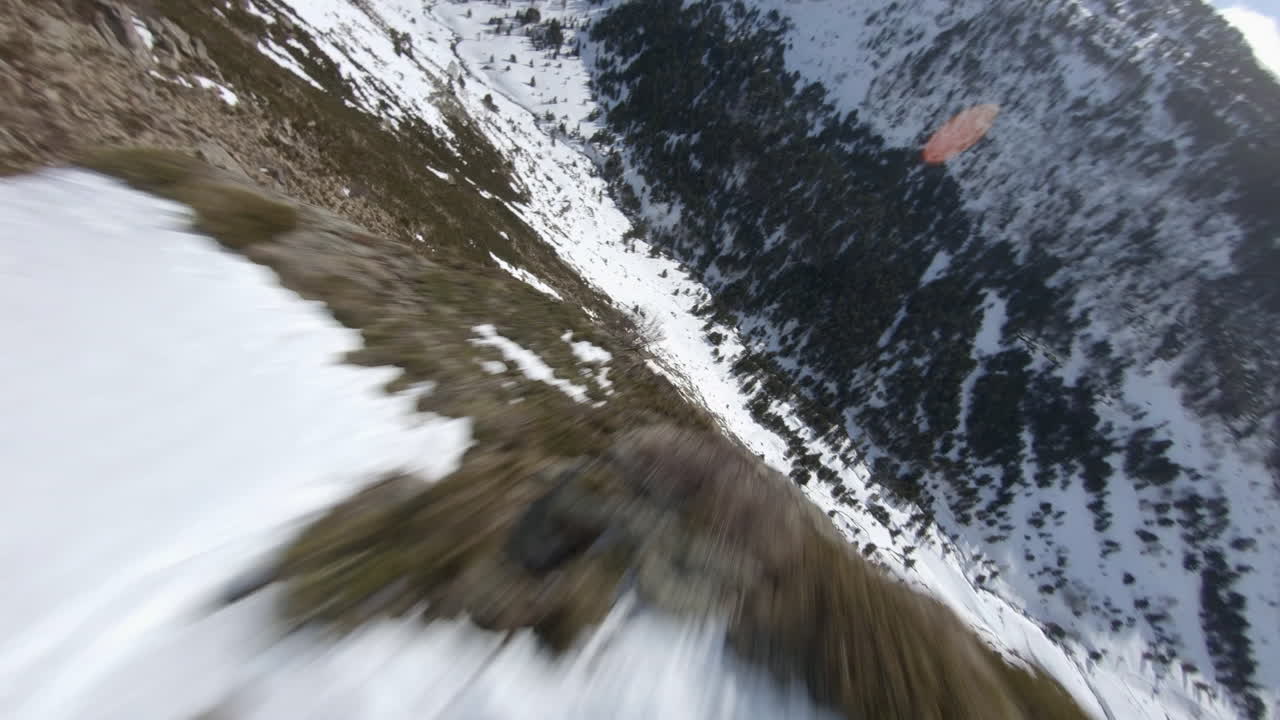 Incredible video of racing drone flying at high speed over snowy landscape of Pyrenees mountains