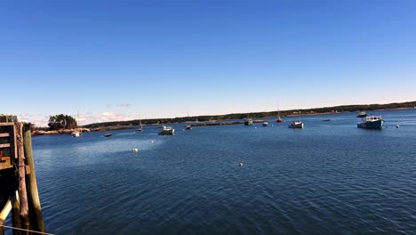 pier at georgetown, maine showing islands and boats and blue skies on ocean