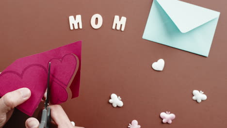 cutting hearts for mother's day craft