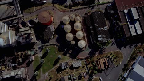 chemical storage tanks in cotton factory, brazil, aerial rise up