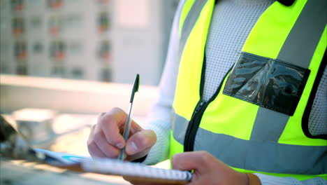 Checklist,-writing-and-clipboard-with-safety-man