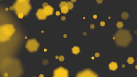 Fly-abstract-yellow-particles-and-glitters-on-black-gradient