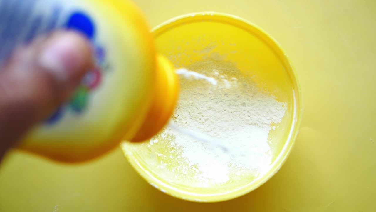 Pouring Baby Powder into a Bowl