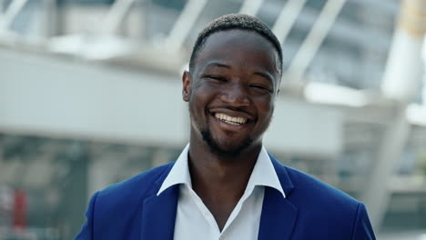 portrait of a smiling african american businessman in a blue suit