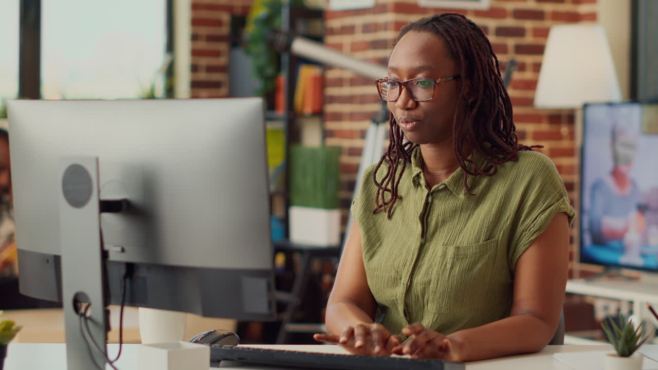 Young woman working remotely from home on company job