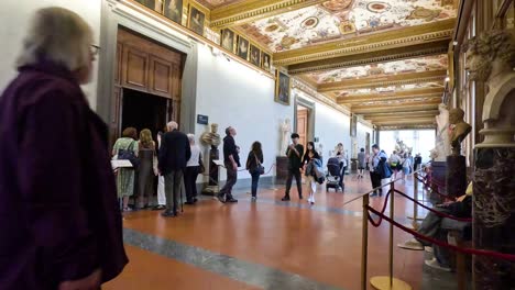 people entering uffizi gallery in florence, italy