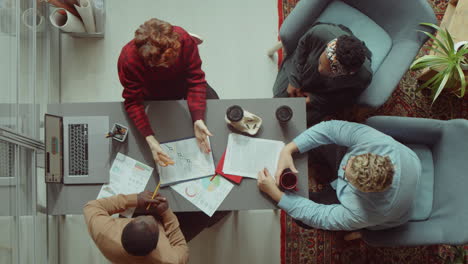 Coworkers-Discussing-Business-Project-in-Office