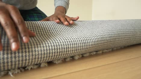 rolling up a rug
