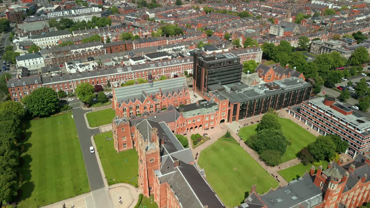 Side-on reversing aerial video of Queen's University Belfast, in Northern Ireland, UK on a bright and sunny day. Produced at 4K resolution, 60FPS and with Rec709 color.