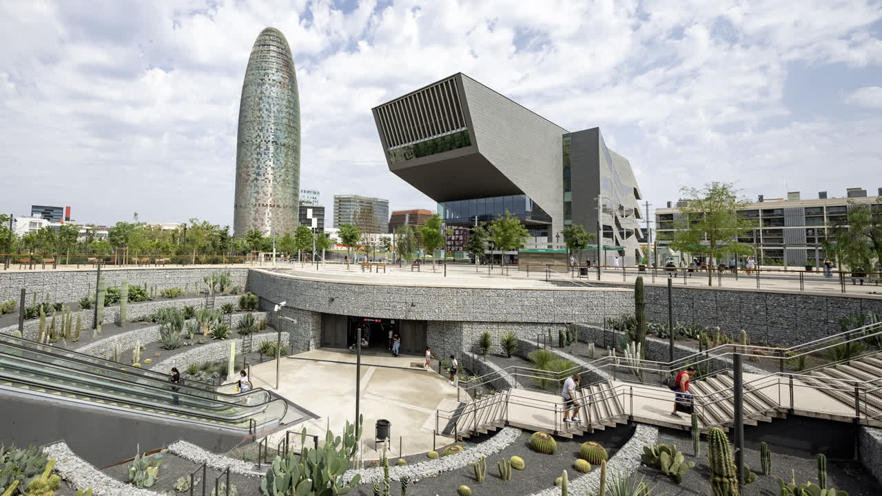 Timelapse of Glories Metro Station In Barcelona and skyline