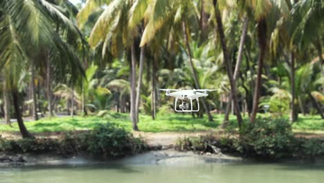 Gimbal-shot-of-immobile-drone-over-lake-in-park