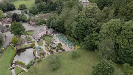 quaint english cockington village aerial view over idyllic thatched cottage landscaped gardens