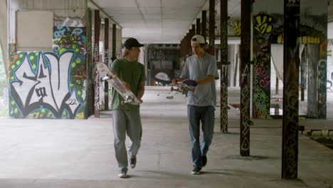 caucasian skateboarders in a ruined building.