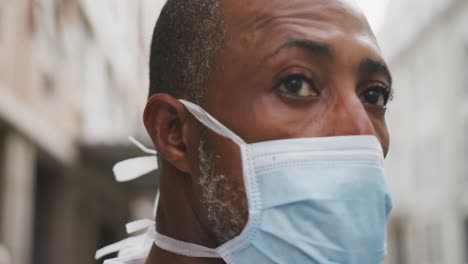 african american man on the go wearing coronavirus covid19 mask