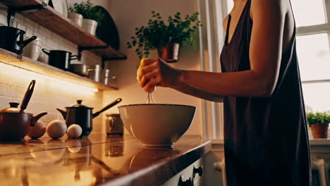 woman squeezing lemon in kitchen