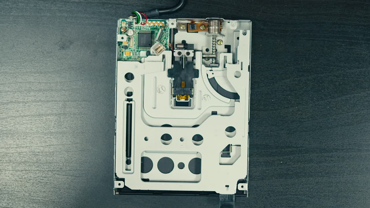 Floppy disc FDD close up, Using diskette for old PC computer macro. Archive programme or Music recorder, playing retro computer games. Vintage device for office, obsolete technology. . High quality 4k footage