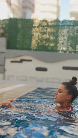 woman relaxing in a swimming pool