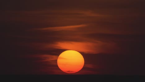 the bright sunset on the night cloud background. time lapse