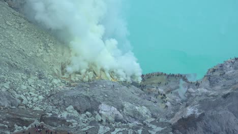 kawah ijen volcano crater caldera lake turquoise-coloured acidic water nature indonesia