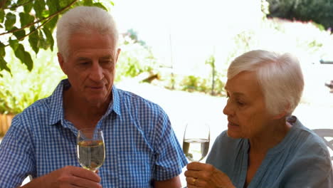 Cute-mature-couple-having-dinner-on-the-terrace