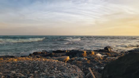 cinemagraph loop of dramatic sunset at a rocky beach