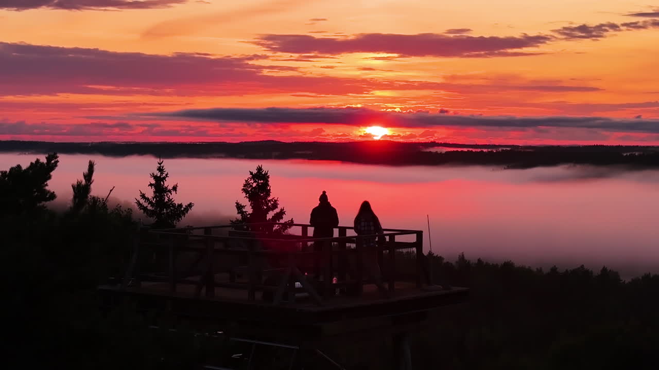 Romantic Sunset Couple Watching Foggy Landscape