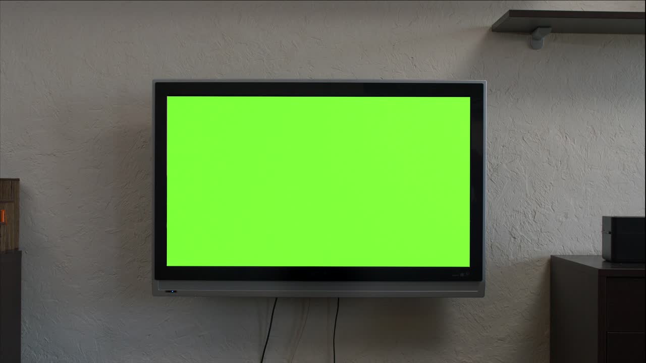 Wall-mounted TV with green screen