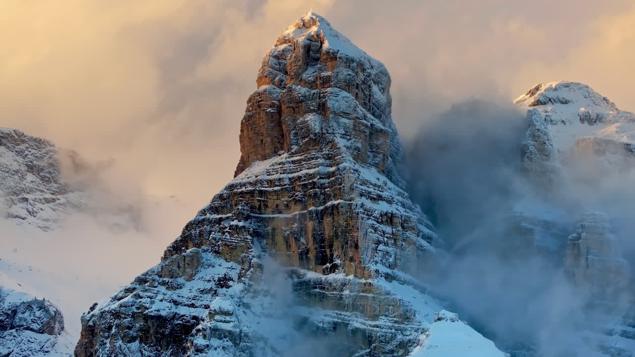 Aerial drone view of snow on the mountains in the Dolomites, Italy