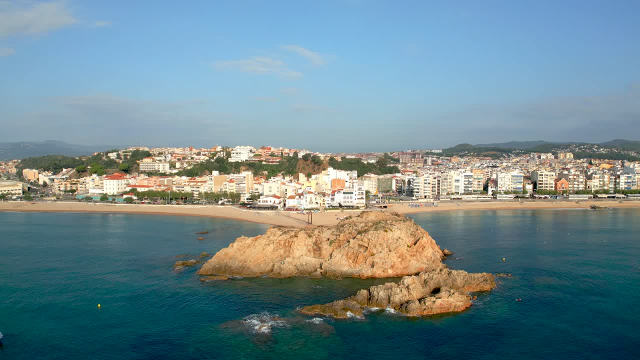 Summer on the Costa Brava, aerial image of the main beach of Blanes close-up of the palomera