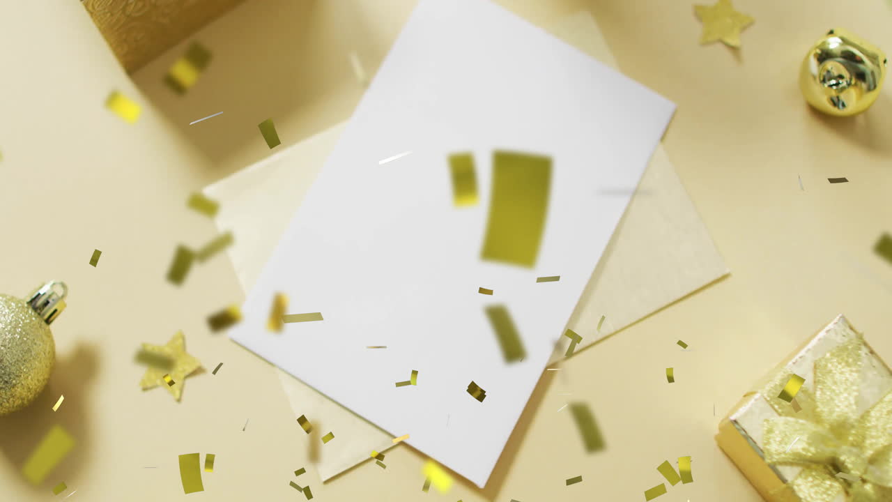 Golden confetti animation over blank card and envelope on festive background