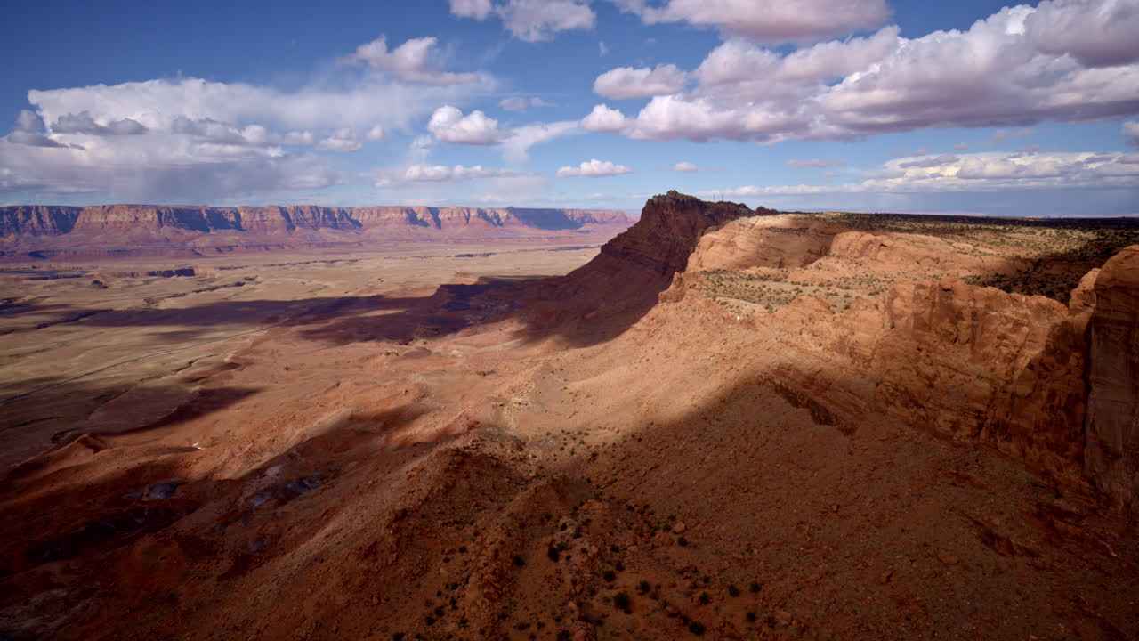 Epic aerial footage soaring parallel to the mountain cliffs, revealing the dizzying heights near Antelope Pass Vista on Highway 89.