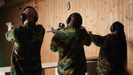 military team in firing range doing shooting course