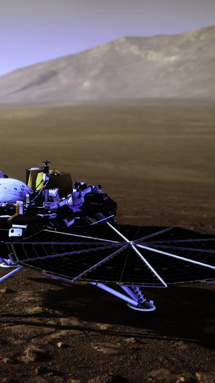 Mars rover explores surface in front of mountain during daylight
