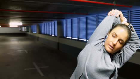 woman exercising at underground car parking lot 4k