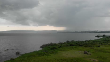 aerial panning view of big tropical storm over lake victoria