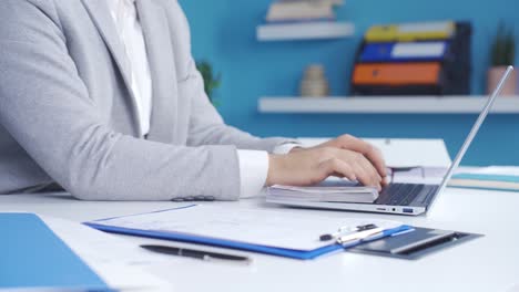 successful and experienced businessman making money counts coins in his office.