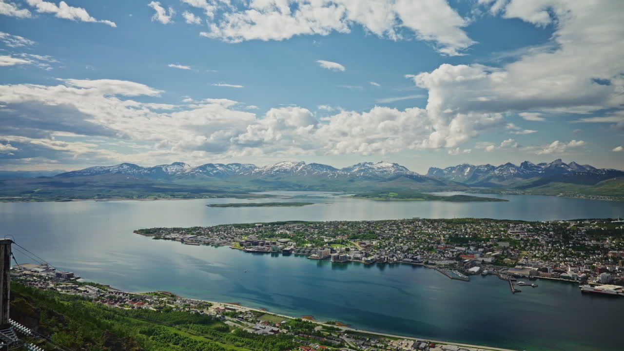 Panoramic view of Tromso, Norway from a high viewpoint.
High view of the nordic city, the landscape and the beautiful Norwegian fjords.