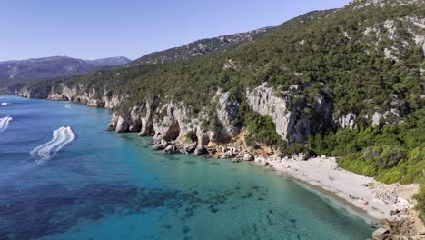 aerial view of a stunning beach with turquoise water and rocky coast