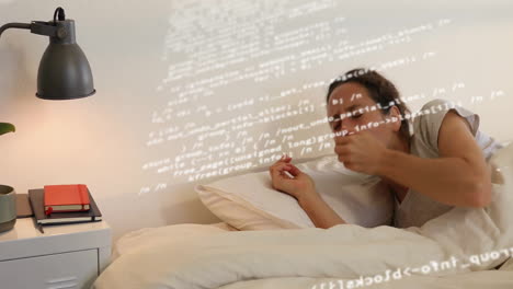 mid adult woman reading paperback book in minimal bedroom, projecting code lines for tech insight