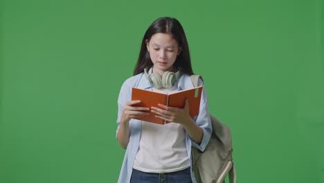 teenage girl reading a book