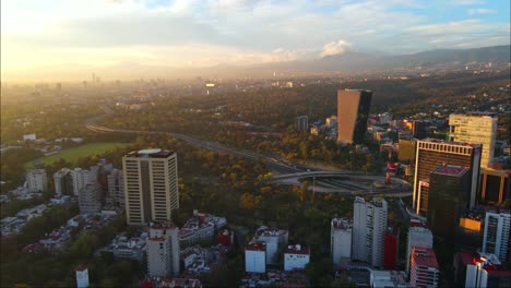 panoramic drone shot of popular buildings west of mexico city on a sunny evening