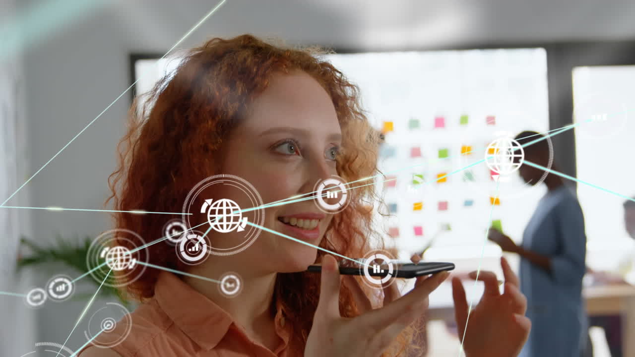 Animation of network of digital icons against caucasian woman talking on smartphone at office