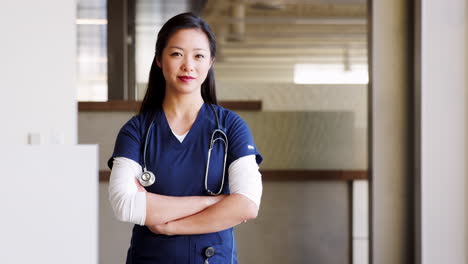 young asian female doctor wearing scrubs