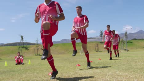 Soccer-players-training-on-field