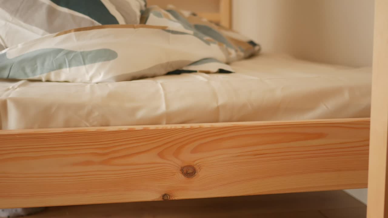 A close-up of a bed with pillows and sheets