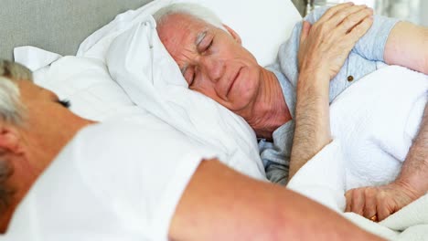 Senior-couple-sleeping-in-the-bedroom