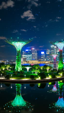gardens by the bay supertrees and singapore city skyline at night